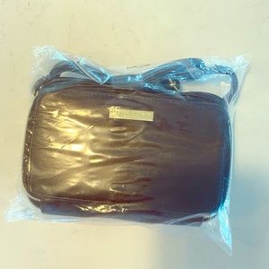 cross over bag with built in battery for phone